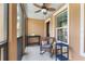 Screened porch with seating area, ceiling fan, and a view of the outdoors at 1065 Clifton Springs Ln, Winter Springs, FL 32708