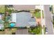 An aerial view of a home with a pool, patio, fenced yard, and other homes and gardens in the neighborhood at 1096 Dees Dr, Oviedo, FL 32765