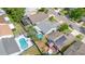 An aerial view of the home and neighborhood highlighting backyards and pools on a sunny day at 1096 Dees Dr, Oviedo, FL 32765
