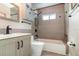 Updated bathroom includes a modern vanity, tiled shower/tub, and sleek fixtures at 1096 Dees Dr, Oviedo, FL 32765