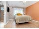 Bedroom offers a queen-sized bed, a TV and ample natural light at 1096 Dees Dr, Oviedo, FL 32765