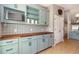 Kitchenette boasts modern cabinetry, open shelving and a wooden countertop at 1096 Dees Dr, Oviedo, FL 32765