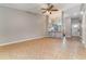 Spacious living room with tile floors and open layout, perfect for entertaining guests at 1096 Dees Dr, Oviedo, FL 32765