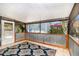 Enclosed patio with tile flooring, providing a versatile outdoor space for relaxation and entertainment at 1096 Dees Dr, Oviedo, FL 32765