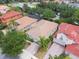 Aerial view of the houses featuring well-maintained landscaping, and the tile roofs at 11878 Via Lucerna Cir, Windermere, FL 34786