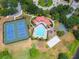 Aerial view of the community featuring a pool, tennis courts, and a playground at 11878 Via Lucerna Cir, Windermere, FL 34786