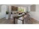 Bright dining room featuring modern decor, neutral tones, and a sliding glass door with backyard view at 11878 Via Lucerna Cir, Windermere, FL 34786