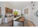 Bright dining room features a modern table, decor, and sliding glass doors to the outdoor living area at 11878 Via Lucerna Cir, Windermere, FL 34786