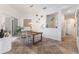 Bright dining room with glass table and seating, complemented by a stylish decorative niche at 11878 Via Lucerna Cir, Windermere, FL 34786