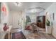 Elegant foyer with tile flooring, chandelier, and a view into a sitting area with large windows at 11878 Via Lucerna Cir, Windermere, FL 34786