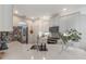Well-lit kitchen with white cabinets, stainless steel appliances, and a stylish backsplash at 11878 Via Lucerna Cir, Windermere, FL 34786
