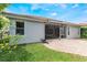 View of the back of the home which has a screened in lanai and small grass yard at 11878 Via Lucerna Cir, Windermere, FL 34786