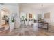 Expansive open-plan living area with tile flooring and seamless connection to the dining and kitchen areas at 11878 Via Lucerna Cir, Windermere, FL 34786