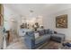Cozy living room with a comfortable sofa, modern decor, and an open layout at 11878 Via Lucerna Cir, Windermere, FL 34786