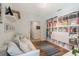 Bright living room with wood floors, a large bookshelf, and a comfortable white couch at 11878 Via Lucerna Cir, Windermere, FL 34786