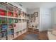 Inviting living room boasts custom built-in shelving and wood floors at 11878 Via Lucerna Cir, Windermere, FL 34786