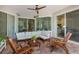 Relaxing covered patio with comfortable seating and views of the landscaped backyard at 11878 Via Lucerna Cir, Windermere, FL 34786