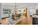 Open-concept dining area with modern chandelier and seamless flow to kitchen at 1218 Fairway Dr, Winter Park, FL 32792