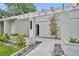 Close-up of the front entrance with lush landscaping and modern house number at 1218 Fairway Dr, Winter Park, FL 32792