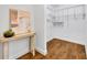 Well-organized walk-in closet featuring adjustable shelving and wood look floors at 1218 Fairway Dr, Winter Park, FL 32792