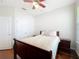 Cozy bedroom with wood floors, ceiling fan, and plenty of natural light at 12724 Bideford Ave, Windermere, FL 34786