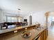 Kitchen with granite countertops open to dining and living area at 12724 Bideford Ave, Windermere, FL 34786