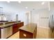 Kitchen featuring stainless steel appliances, granite countertops, and a center island at 12724 Bideford Ave, Windermere, FL 34786