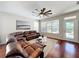 Comfortable living room with large window, fan, and access to outside at 12724 Bideford Ave, Windermere, FL 34786