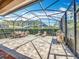 Screened-in patio with dining and lounge furniture, plus an outdoor grill for outdoor enjoyment at 12724 Bideford Ave, Windermere, FL 34786
