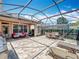 Screened-in patio with ample space for entertaining and relaxing at 12724 Bideford Ave, Windermere, FL 34786