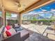 Screened-in patio with ceiling fan, outdoor furniture, and a grill perfect for entertaining at 12724 Bideford Ave, Windermere, FL 34786