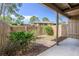 Private fenced backyard featuring wood fencing, a concrete patio, and minimal garden area at 135 Heron Bay Cir, Lake Mary, FL 32746