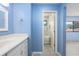 Bright bathroom featuring modern fixtures and a tiled walk in shower at 135 Heron Bay Cir, Lake Mary, FL 32746