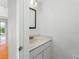 Bathroom featuring vanity, sink, framed mirror and modern lighting fixture at 135 Heron Bay Cir, Lake Mary, FL 32746