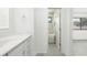 Neutral bath with walk-in shower, updated vanity, and access from the main bedroom at 135 Heron Bay Cir, Lake Mary, FL 32746