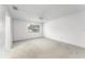 Bright bedroom features a window overlooking the neighborhood, and neutral carpet flooring at 135 Heron Bay Cir, Lake Mary, FL 32746