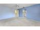 A carpeted bedroom with a ceiling fan, and an ensuite bathroom at 135 Heron Bay Cir, Lake Mary, FL 32746