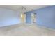 Carpeted bedroom with a ceiling fan and ensuite bathroom at 135 Heron Bay Cir, Lake Mary, FL 32746