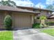 Charming townhouse exterior featuring a one car garage, driveway and beautifully maintained landscaping at 135 Heron Bay Cir, Lake Mary, FL 32746