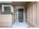 Inviting front door with a neutral color scheme complemented by a large window and clean entryway at 135 Heron Bay Cir, Lake Mary, FL 32746
