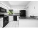 Modern kitchen boasting stainless steel appliances, granite countertops, and a sleek design for culinary enthusiasts at 135 Heron Bay Cir, Lake Mary, FL 32746
