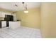 Eat in Kitchen offering white cabinets, black appliances, and a chandelier at 135 Heron Bay Cir, Lake Mary, FL 32746