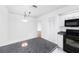 Functional kitchen with an island, black appliances, and white cabinets, providing efficiency and style for cooking needs at 135 Heron Bay Cir, Lake Mary, FL 32746