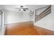 Bright living room with hardwood floors, fan, and access to a balcony to enjoy the natural light and fresh air at 135 Heron Bay Cir, Lake Mary, FL 32746
