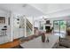 Bright living room features a fireplace, hardwood floors and large glass doors to let in lots of light at 135 Heron Bay Cir, Lake Mary, FL 32746