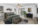 Bright main bedroom featuring a ceiling fan, balcony access, and tasteful decor for a relaxing atmosphere at 135 Heron Bay Cir, Lake Mary, FL 32746