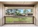 View from the porch overlooking the community's green space and mature trees, offering a serene setting at 135 Heron Bay Cir, Lake Mary, FL 32746