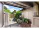 Charming walkway with lush plants and a wooden fence leading to the entrance at 135 Heron Bay Cir, Lake Mary, FL 32746