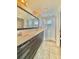 Modern bathroom boasts double vanity, sleek cabinets, a walk-in shower with glass door at 144 Angelas Ave, Haines City, FL 33844