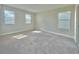 Bright bedroom filled with natural light from three large windows and plush carpeting at 144 Angelas Ave, Haines City, FL 33844